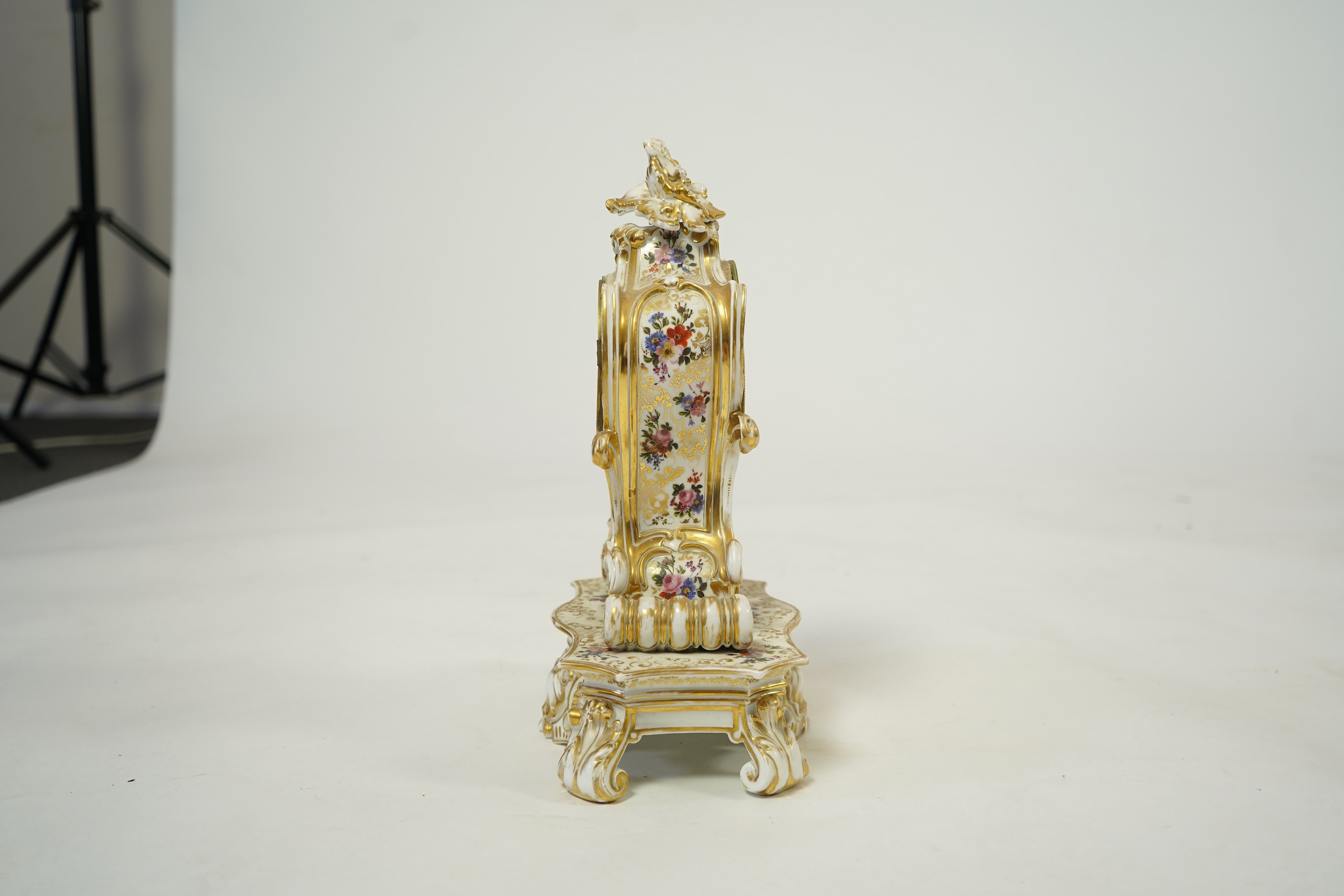 A mid 19th century French porcelain floral and gilt decorated clock, by Jacob Petit